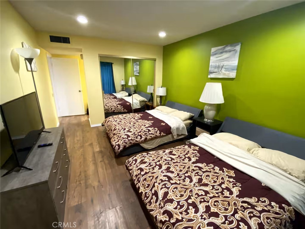 250 East San Jose Road, Unit 63 Palm Springs, CA 92264 - Photo 5 of 22 a bedroom with bed and a flat screen tv