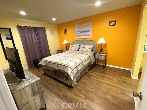 250 East San Jose Road, Unit 63 Palm Springs, CA 92264 - Photo 6 of 22 a bedroom with a bed and a flat screen tv