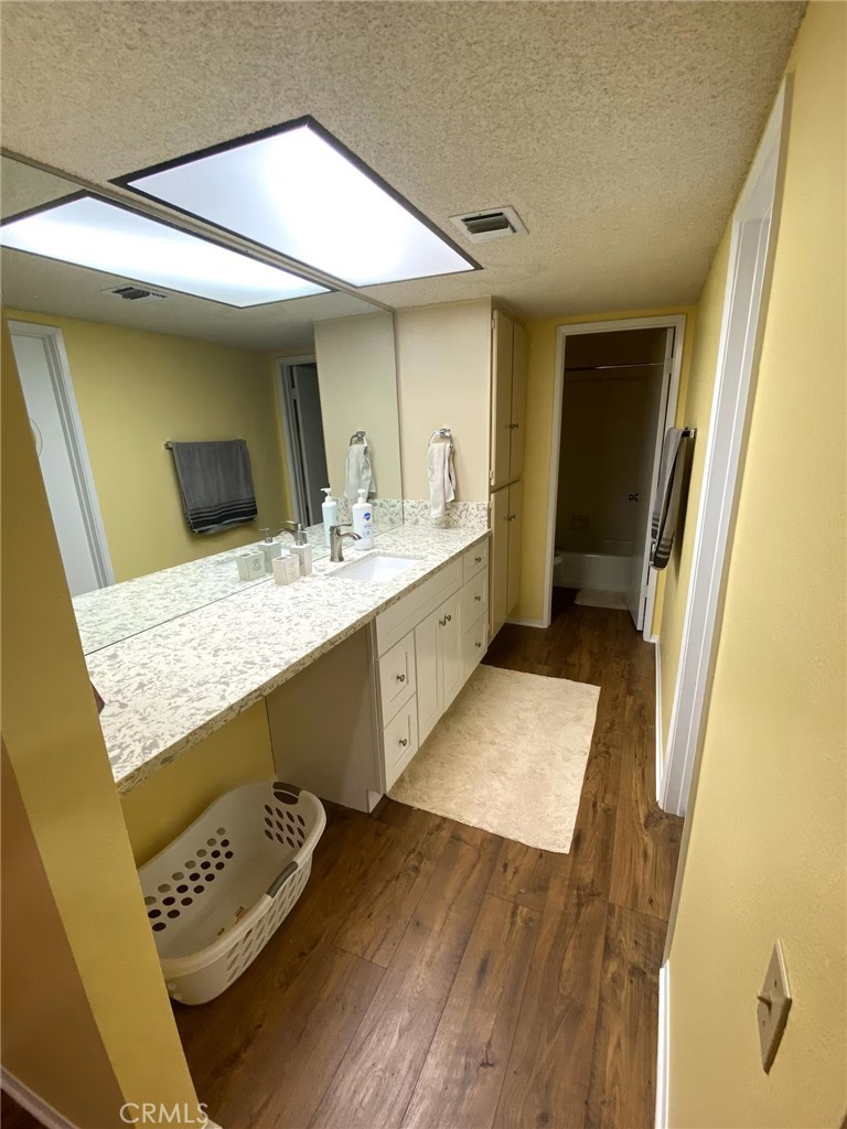 250 East San Jose Road, Unit 63 Palm Springs, CA 92264 - Photo 8 of 22 a bathroom with a granite countertop sink and a mirror