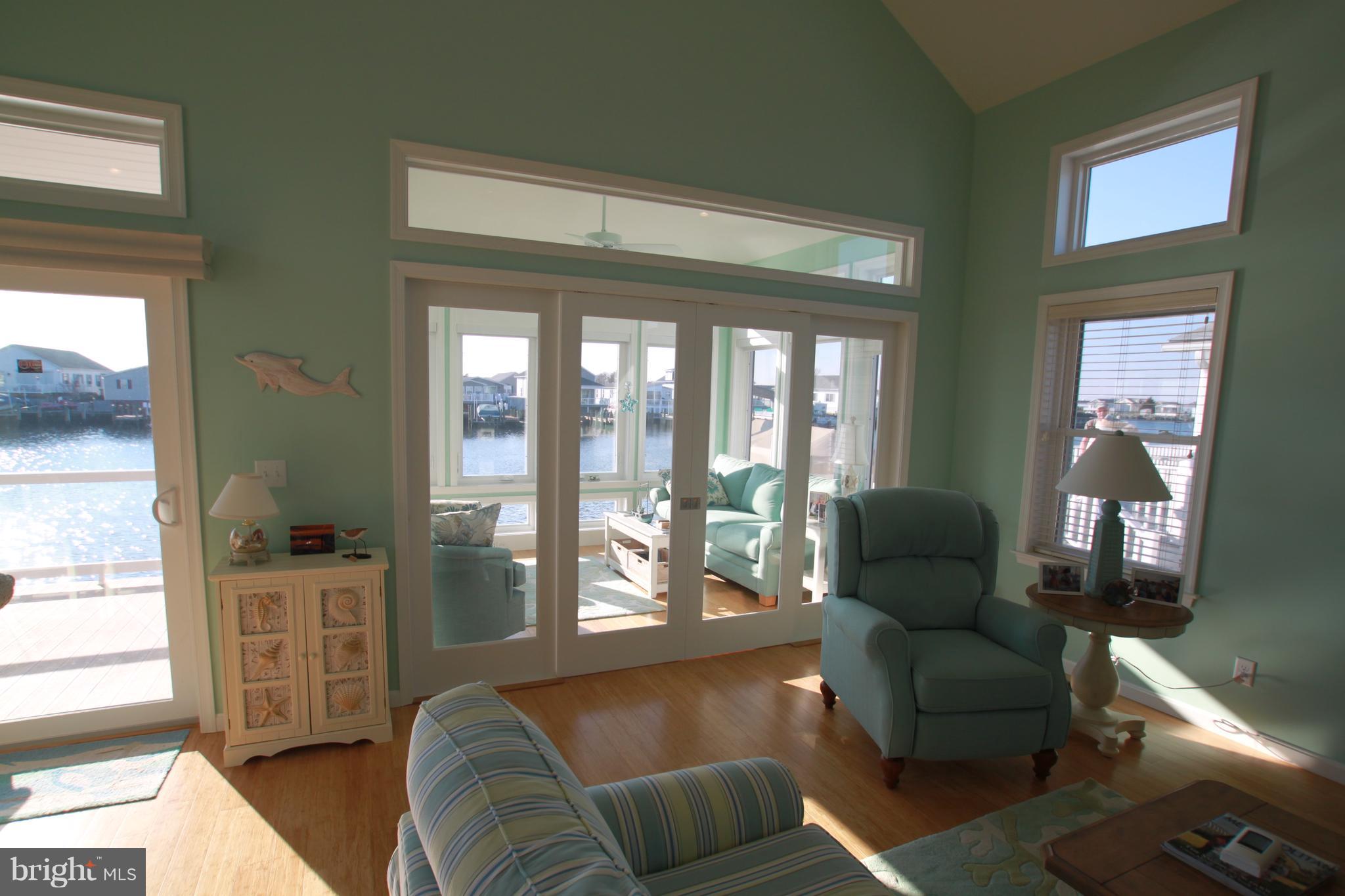 163 Pine Tree Road Ocean City, MD 21842 - Photo 15 of 57 Sun room w/ glass doors shut