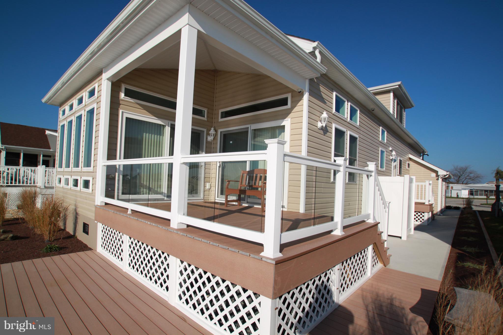 163 Pine Tree Road Ocean City, MD 21842 - Photo 5 of 57 Waterfront porch off sun room & dining rm