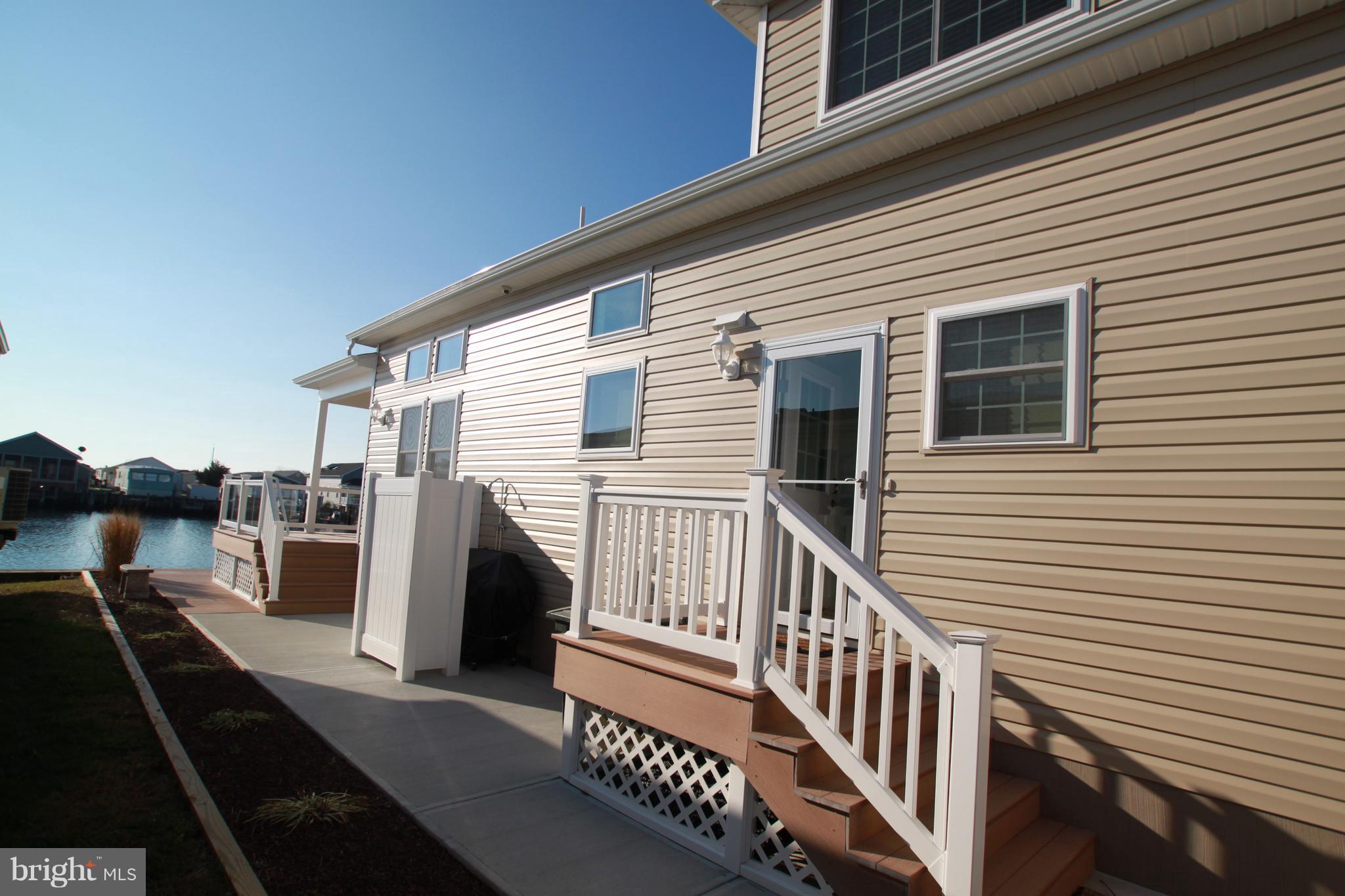 163 Pine Tree Road Ocean City, MD 21842 - Photo 6 of 57 Outside shower & grill