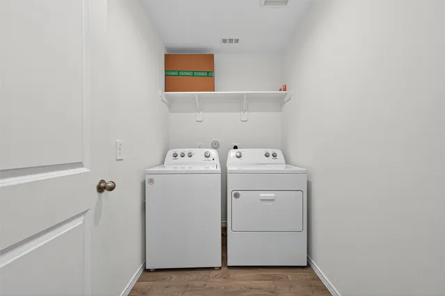 a utility room with dryer and washer