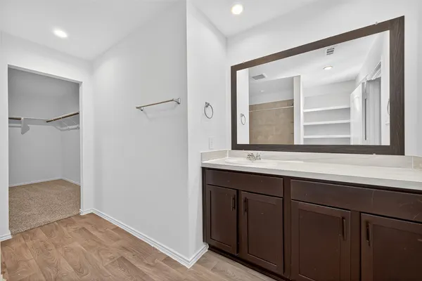 a bathroom with a tub and shower