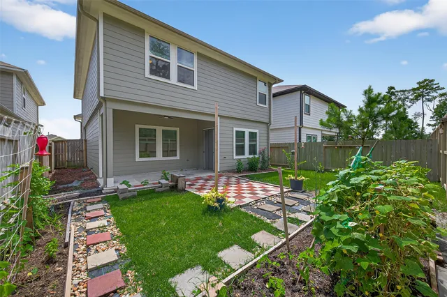 a sign board with flower plants