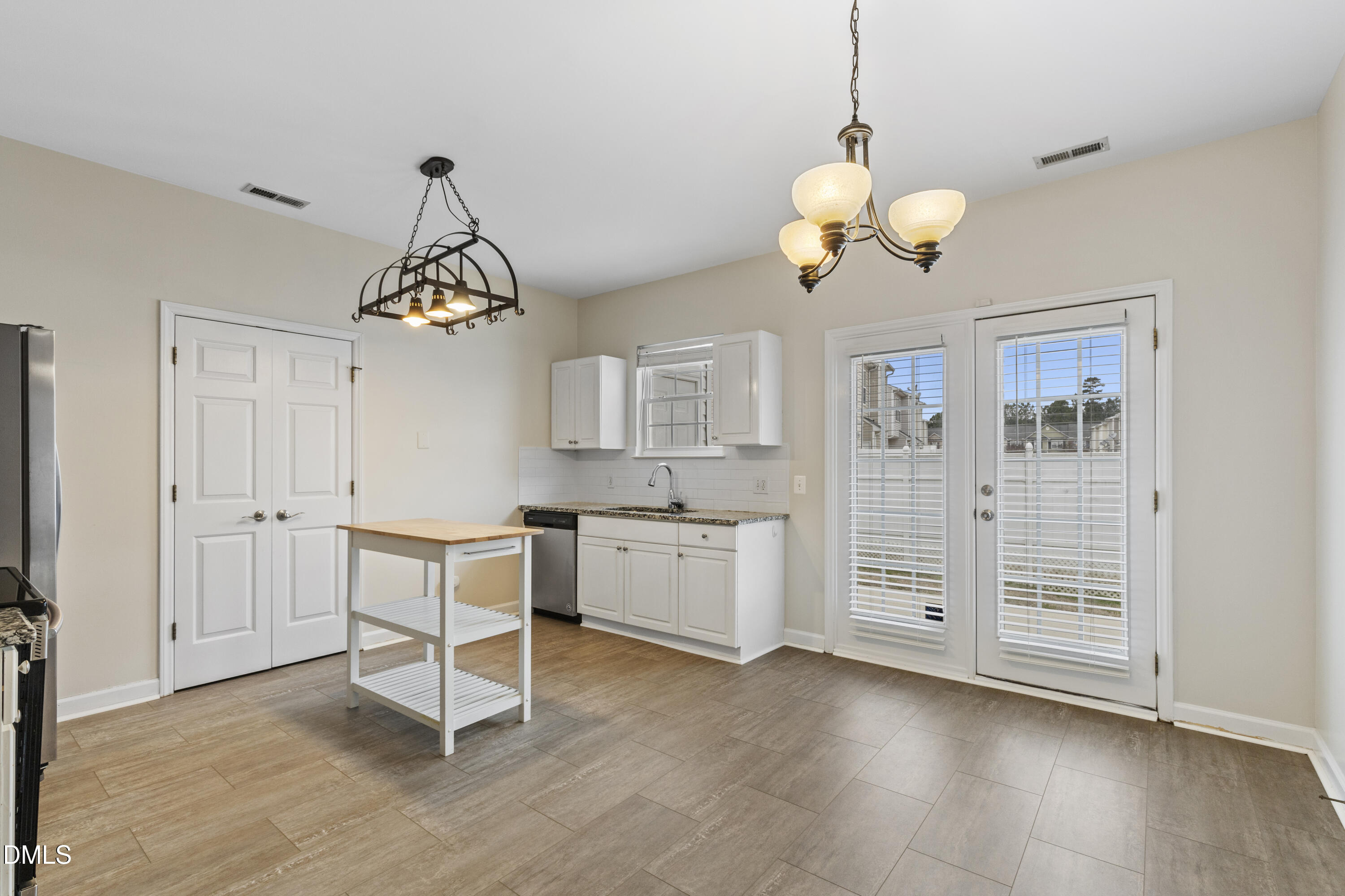 6013 San Marcos Way Raleigh, NC 27616 - Photo 7 of 21 a view of a bedroom with a furniture and a chandelier