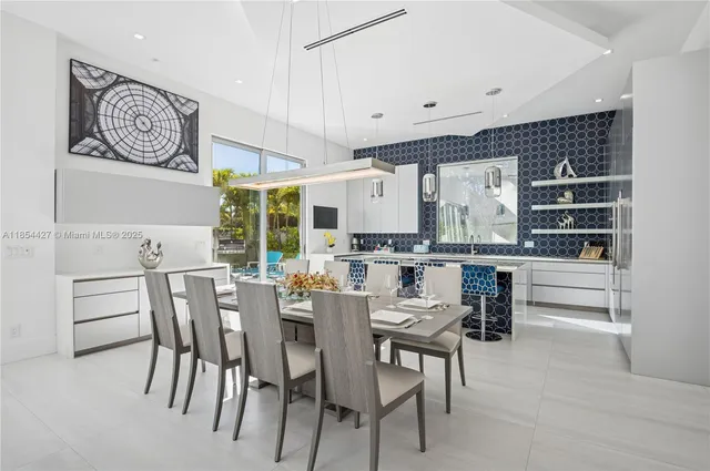 a kitchen with a wooden floor and cabinets