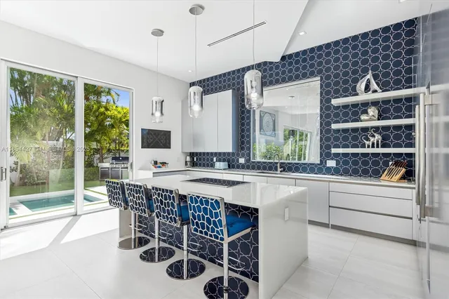 a kitchen with a table chairs sink and cabinets