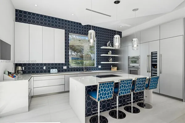 a view of a living room and kitchen