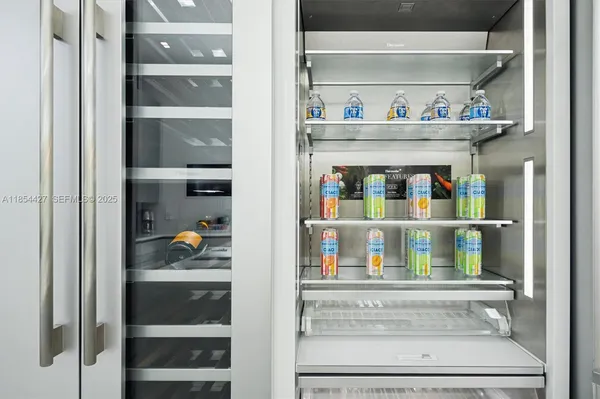 a large kitchen with kitchen island a large counter space a sink and appliances