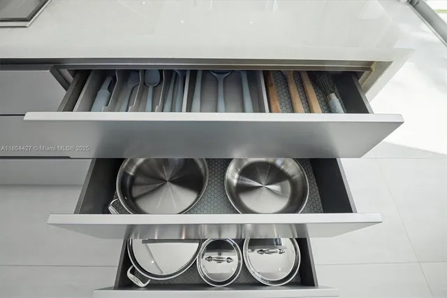 a living room with furniture and painting on the wall