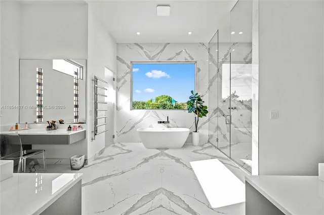 a bathroom with a bathtub and shower