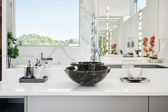 a bathroom with a toilet sink vanity and mirror