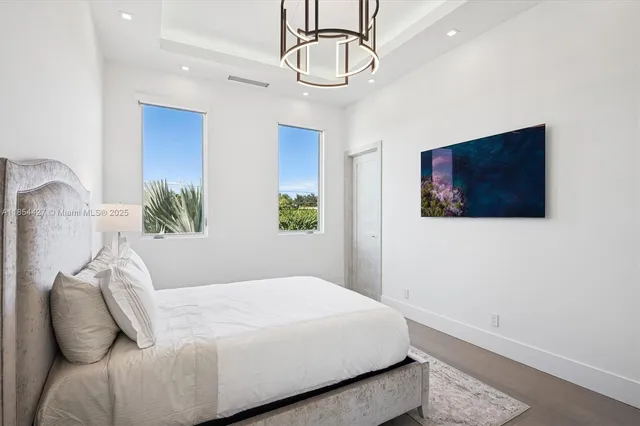 an aerial view of residential building and ocean