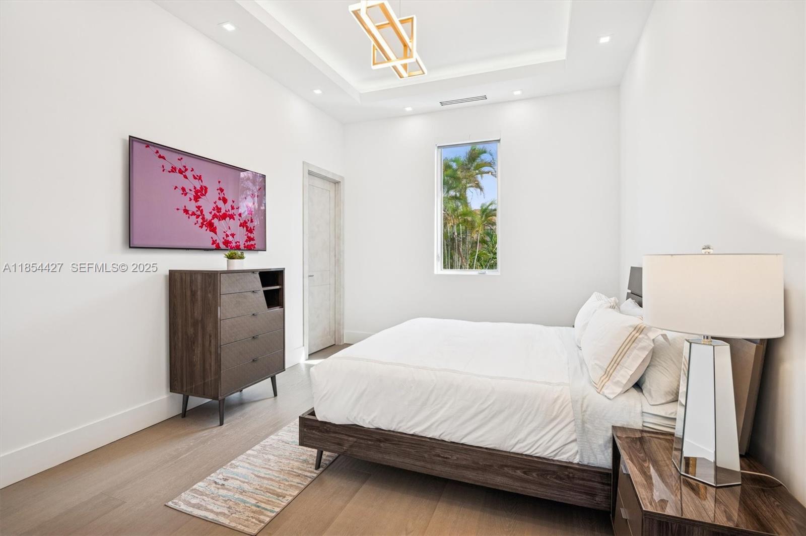 2628 Marcinski Road Jupiter, FL 33477 - Photo 49 of 70 a bedroom with a bed and a desk