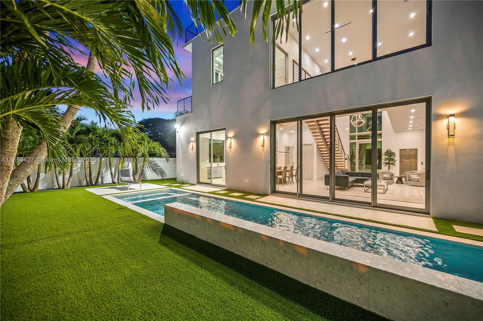 2628 Marcinski Road Jupiter, FL 33477 - Photo 58 of 70 a view of a house with a swimming pool