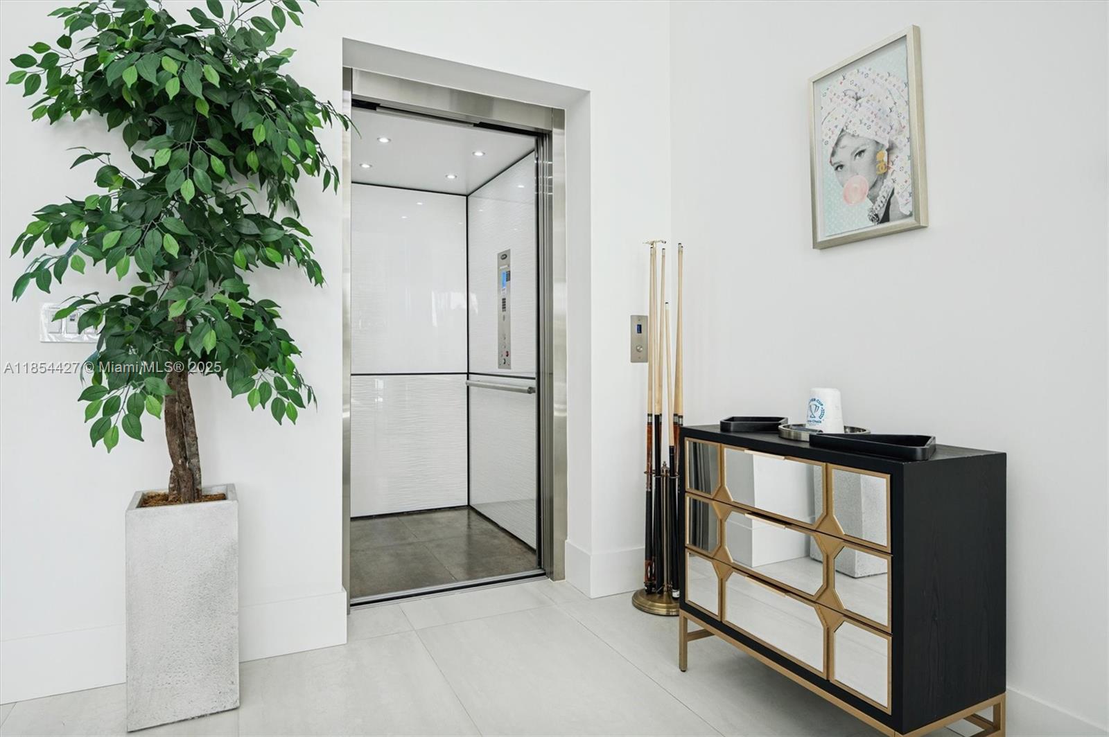 2628 Marcinski Road Jupiter, FL 33477 - Photo 7 of 70 a view of livingroom with furniture and a potted plant