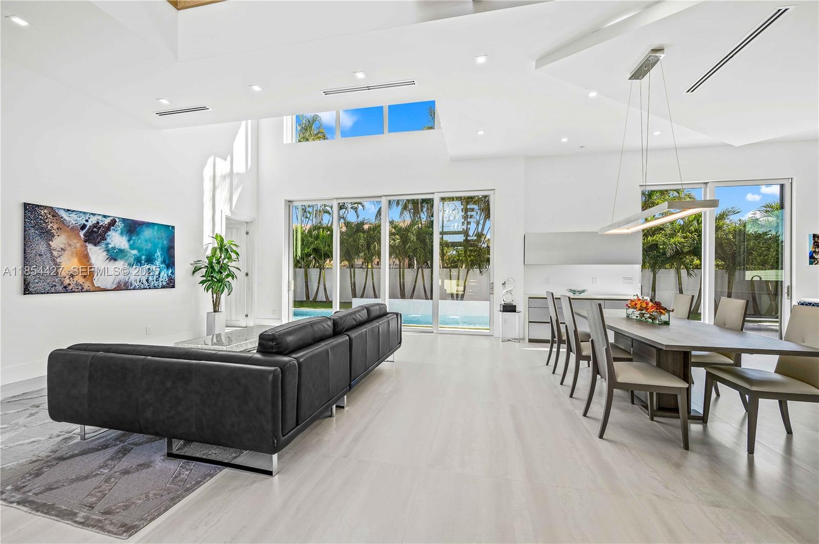 2628 Marcinski Road Jupiter, FL 33477 - Photo 8 of 70 a living room with furniture and large windows