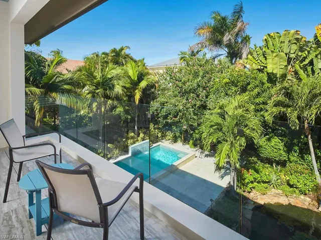 a view of a chairs and table in patio