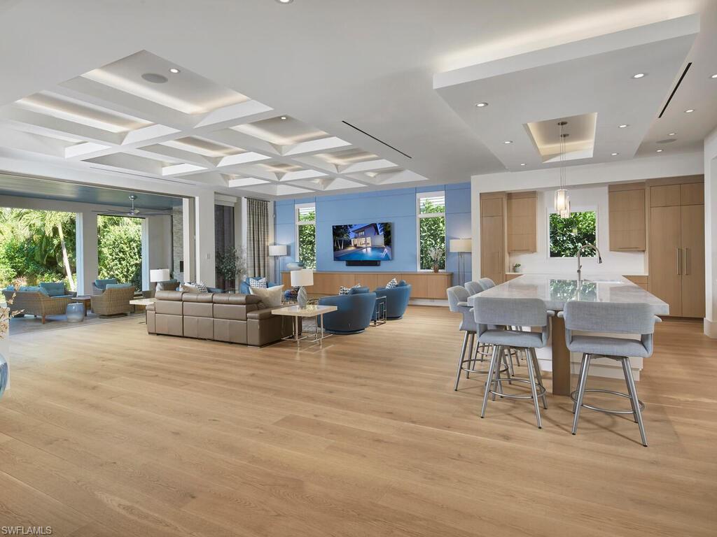 355 7th Avenue South Naples, FL 34102 - Photo 2 of 37 a living room with furniture and a large window