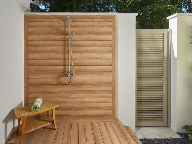 a view of a door and chair in the balcony