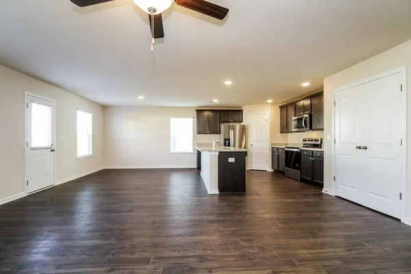 a view of kitchen with wooden floor