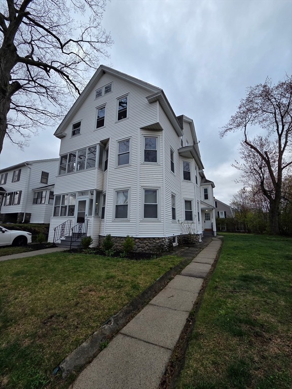 15 Berkmans Street, Unit 2 Worcester, MA 01602 - Photo 13 of 13 a front view of a house with a garden