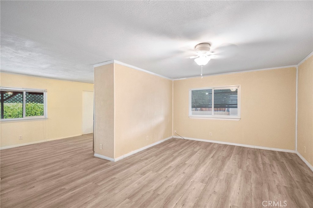 3156 Esplanade, Unit 292 Chico, CA 95973 - Photo 12 of 32 wooden floor in an empty room with a window