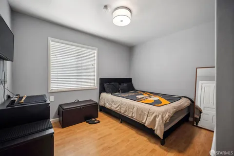 a bedroom with a bed and a chair