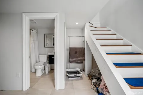 a room with a chair and white walls