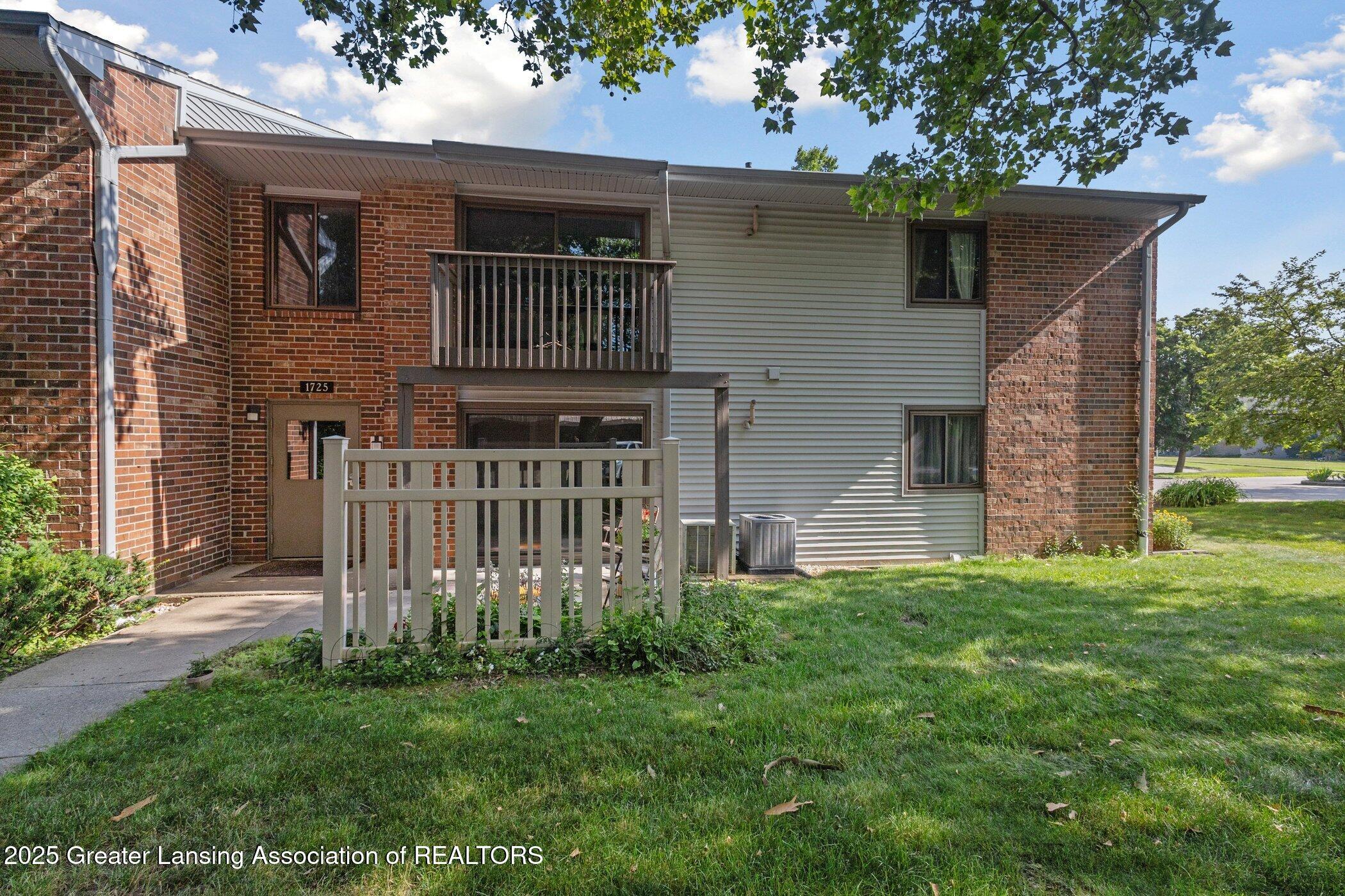 1725 Maple Ridge Road, Unit 60 Haslett, MI 48840 - Photo 1 of 16 patio back of building