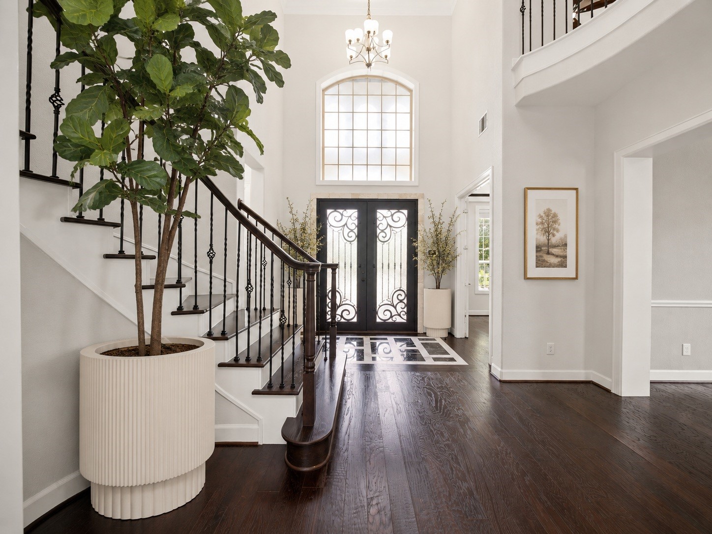 3622 Sage Hollow Drive Spring, TX 77386 - Photo 6 of 46 Every corner of this foyer radiates minimalist luxury, anchoring the grand entry with rich 5-inch Nottoway Hickory wide-plank hardwood floors that extend beautifully across the main level. Virtually staged.