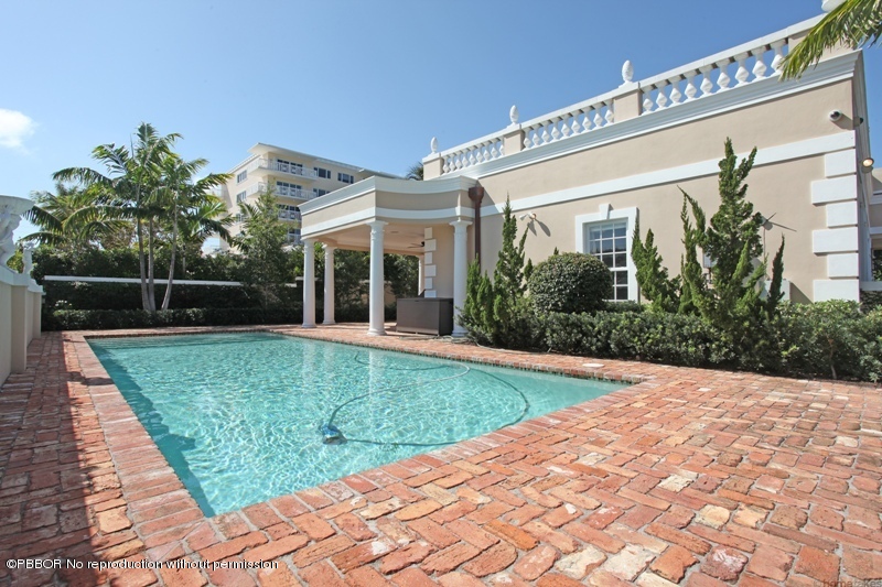 300 Dunbar Road Palm Beach, FL 33480 - Photo 2 of 14 a view of a house with backyard and garden