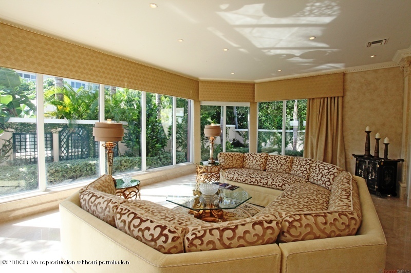 300 Dunbar Road Palm Beach, FL 33480 - Photo 4 of 14 a living room with a large window and a table