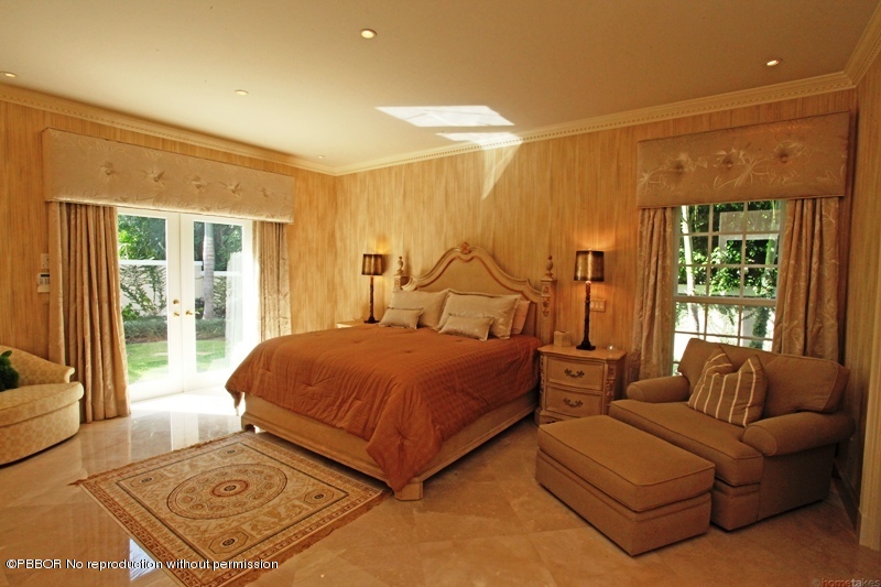 300 Dunbar Road Palm Beach, FL 33480 - Photo 7 of 14 a bedroom with a bed couch and window