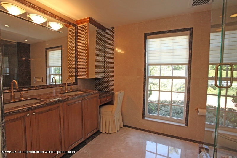 300 Dunbar Road Palm Beach, FL 33480 - Photo 10 of 14 a bathroom with a sink mirror and a window