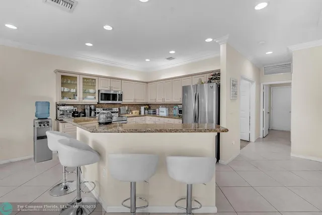 a kitchen with lots of counter space and appliances