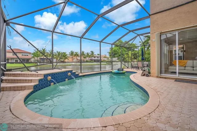 a view of a swimming pool with a patio