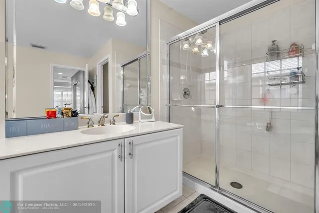 a spacious bedroom with a bed and a large window