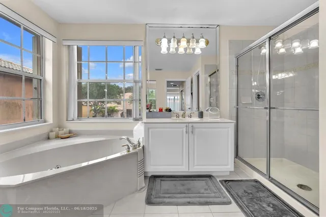 a view of storage and utility room with washer and dryer
