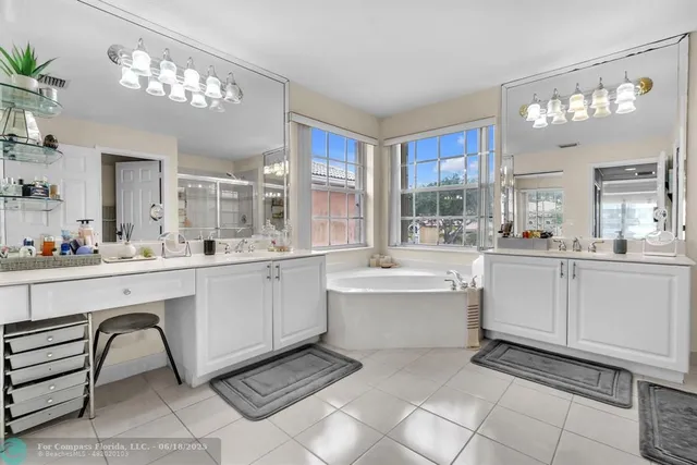a view of walk in closet with clothes