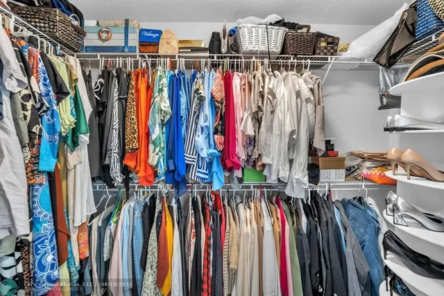 a view of swimming pool with a patio and a garden
