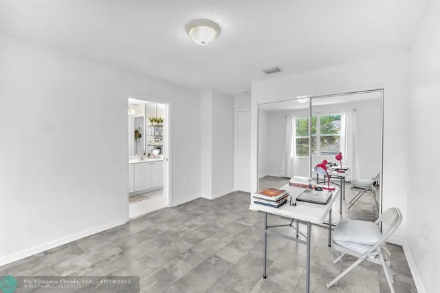 a view of a house with a yard and sitting area