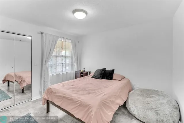 a view of a city with lots of residential buildings lake and ocean view