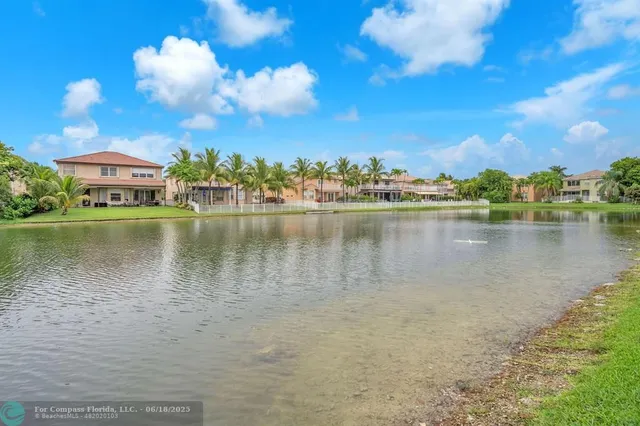 a view of a lake with a building in the background