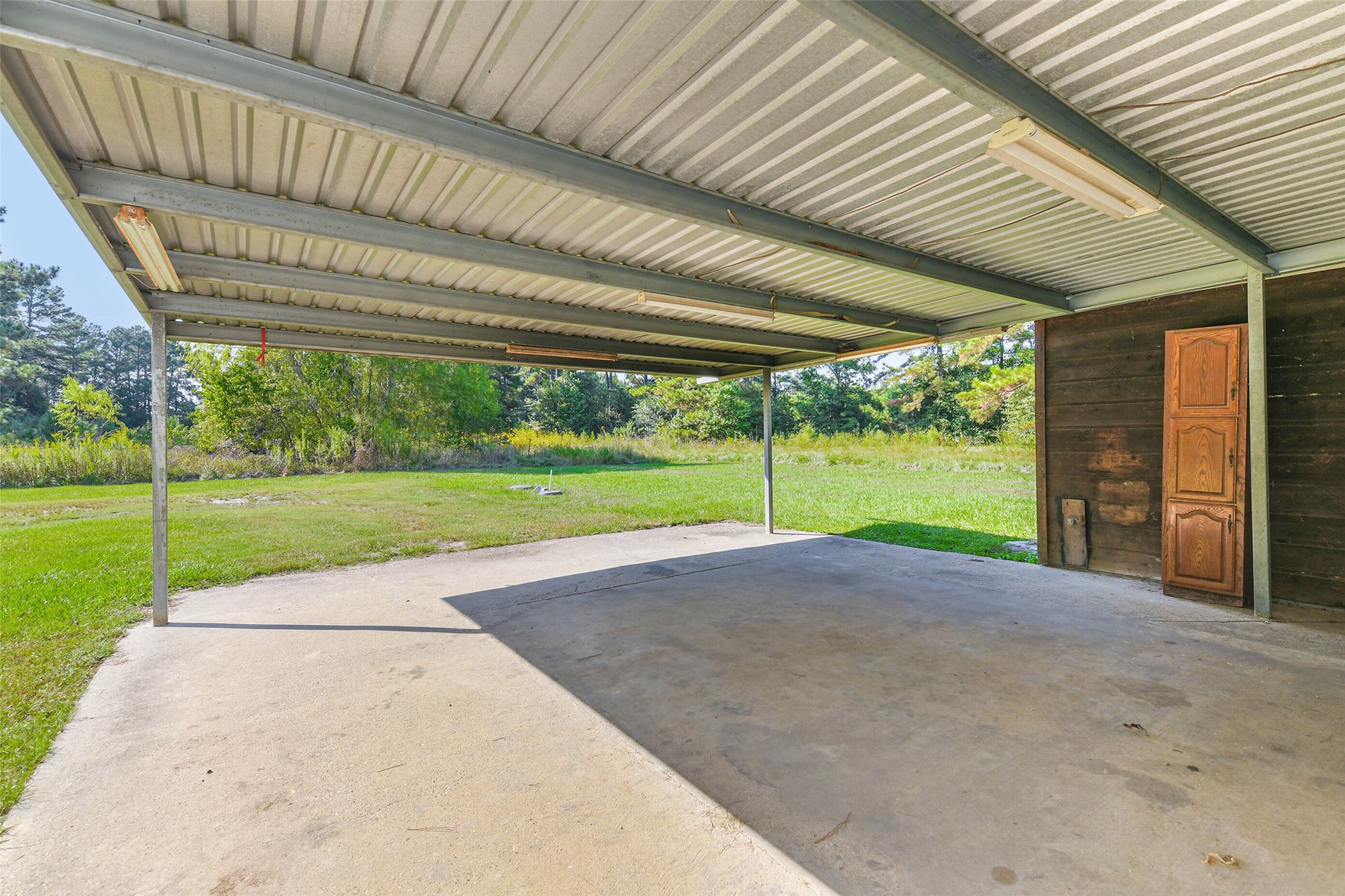 4869 Fm 2518 Cleveland, TX 77327 - Photo 11 of 41 a view of a house with backyard and porch
