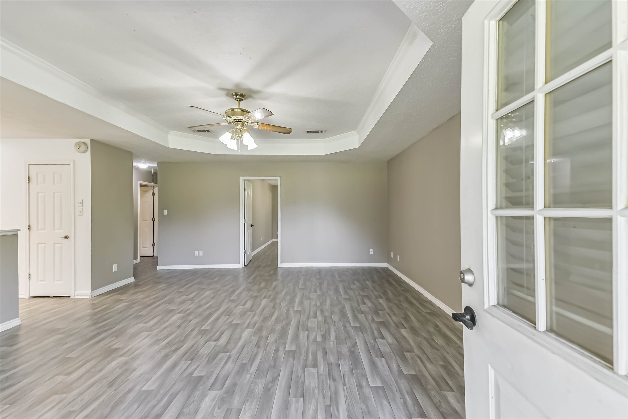 4869 Fm 2518 Cleveland, TX 77327 - Photo 23 of 41 wooden floor in an empty room with a window