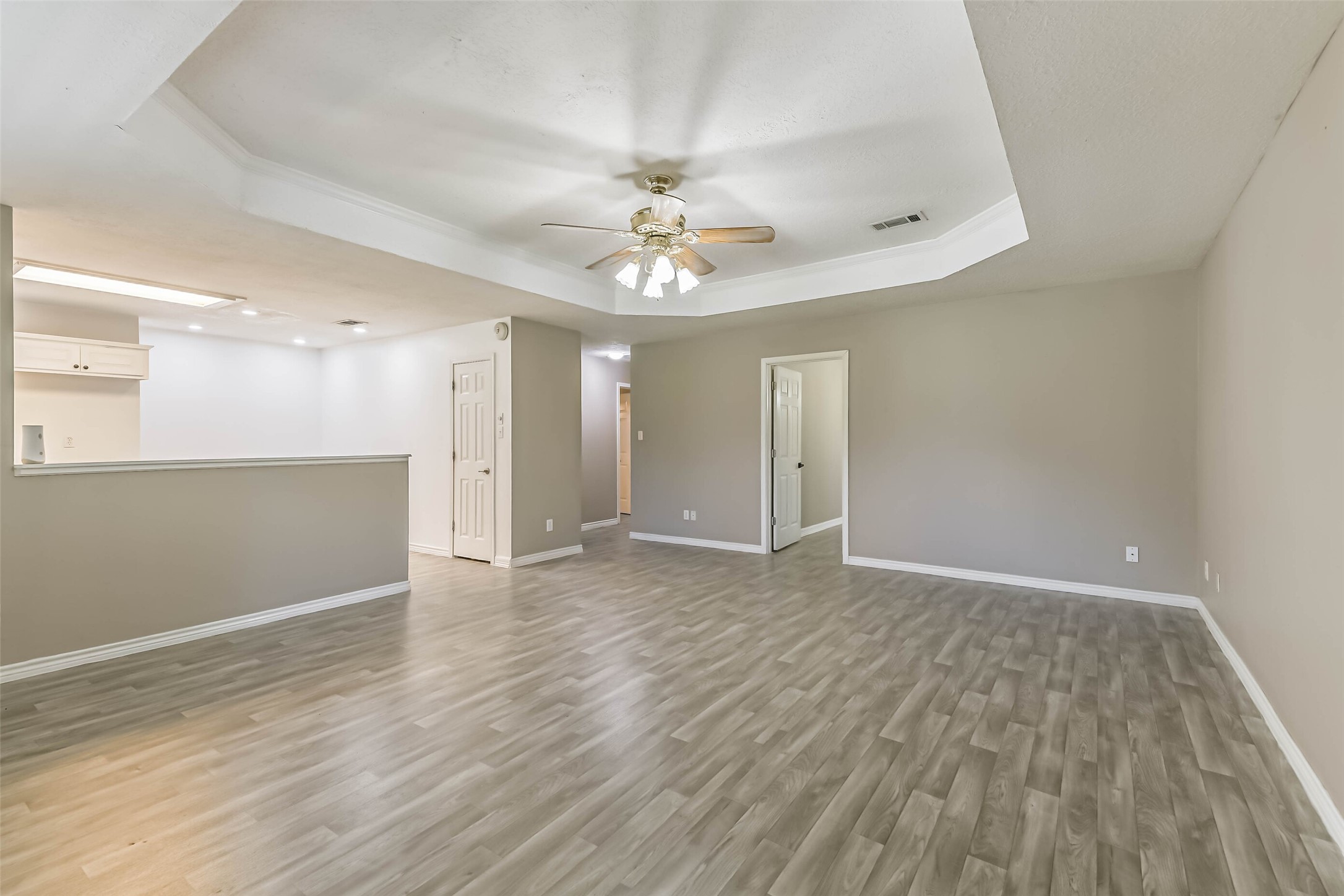 4869 Fm 2518 Cleveland, TX 77327 - Photo 24 of 41 wooden floor in an empty room with a window