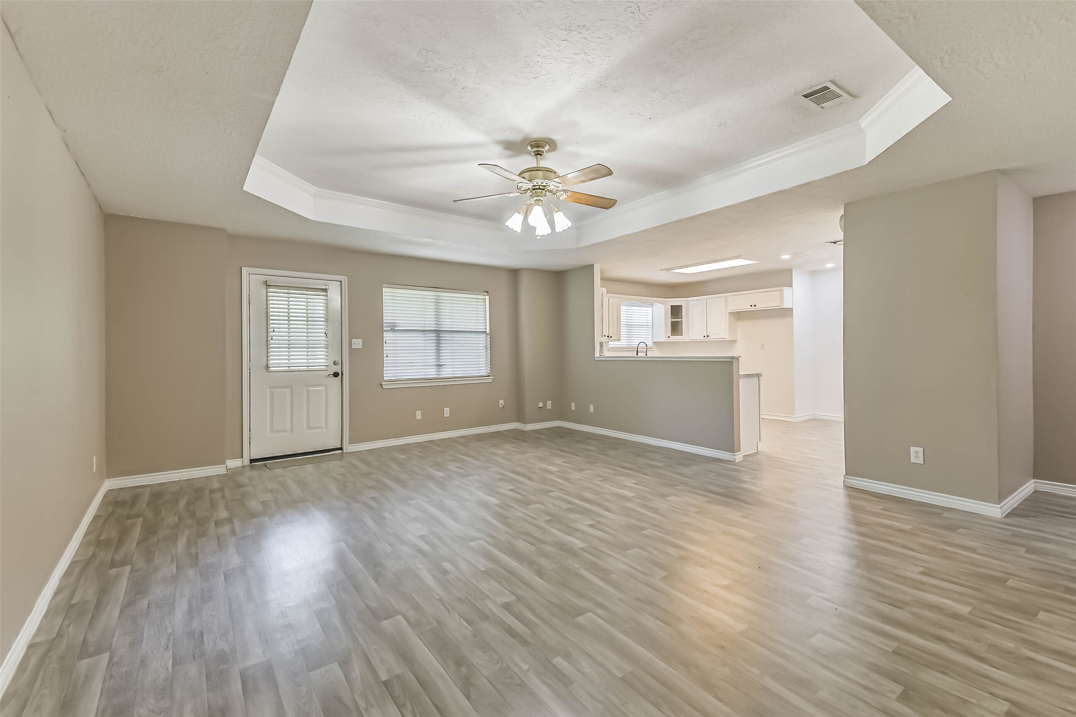 4869 Fm 2518 Cleveland, TX 77327 - Photo 25 of 41 an empty room with wooden floor and windows