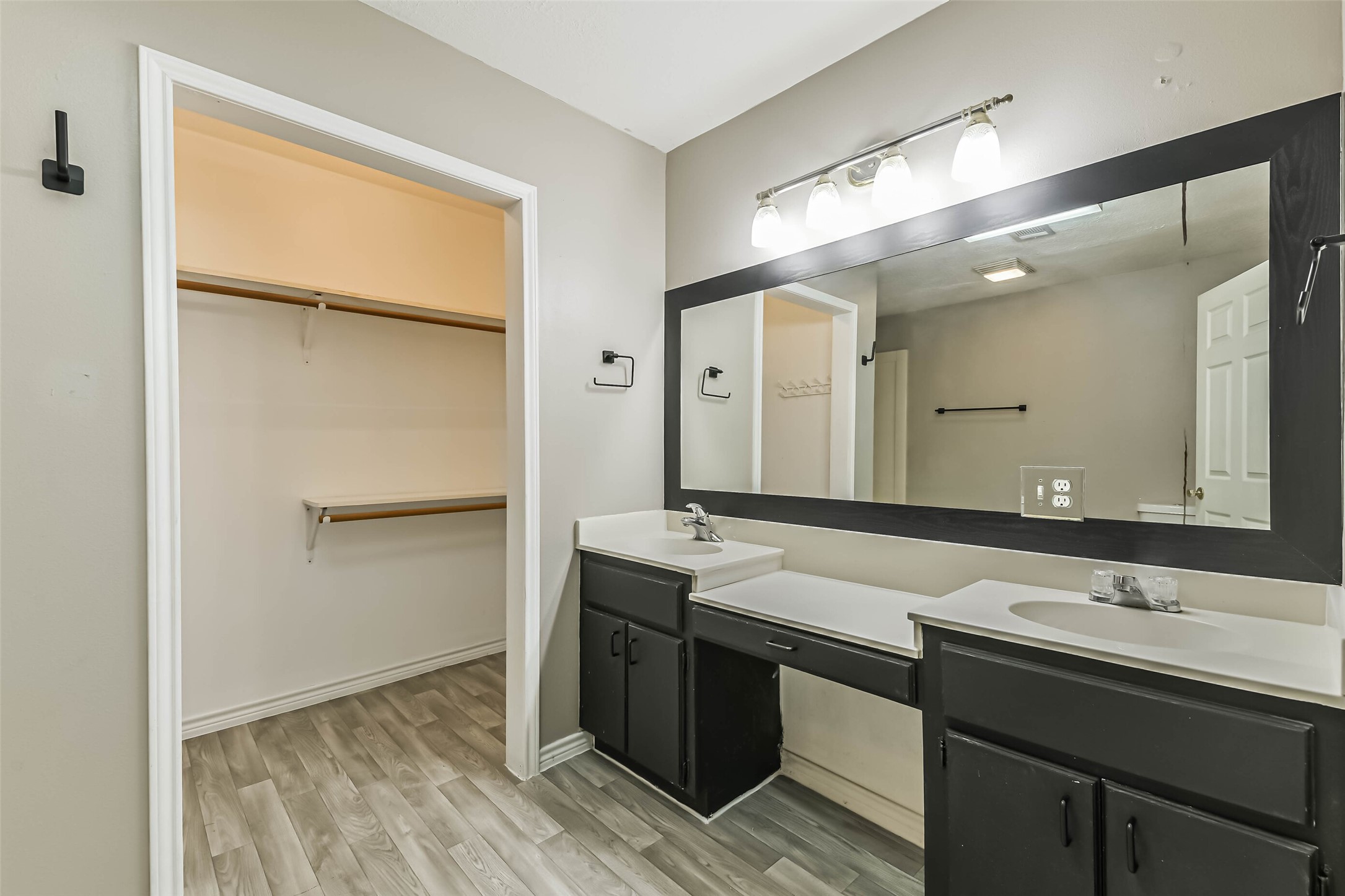 4869 Fm 2518 Cleveland, TX 77327 - Photo 32 of 41 a bathroom with a sink and mirror